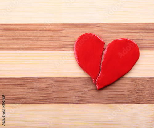 broken heart on a wooden texture