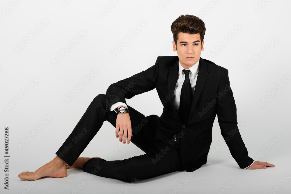 Young businessman barefoot, isolated on white background Young businessman barefoot, isolated on white background