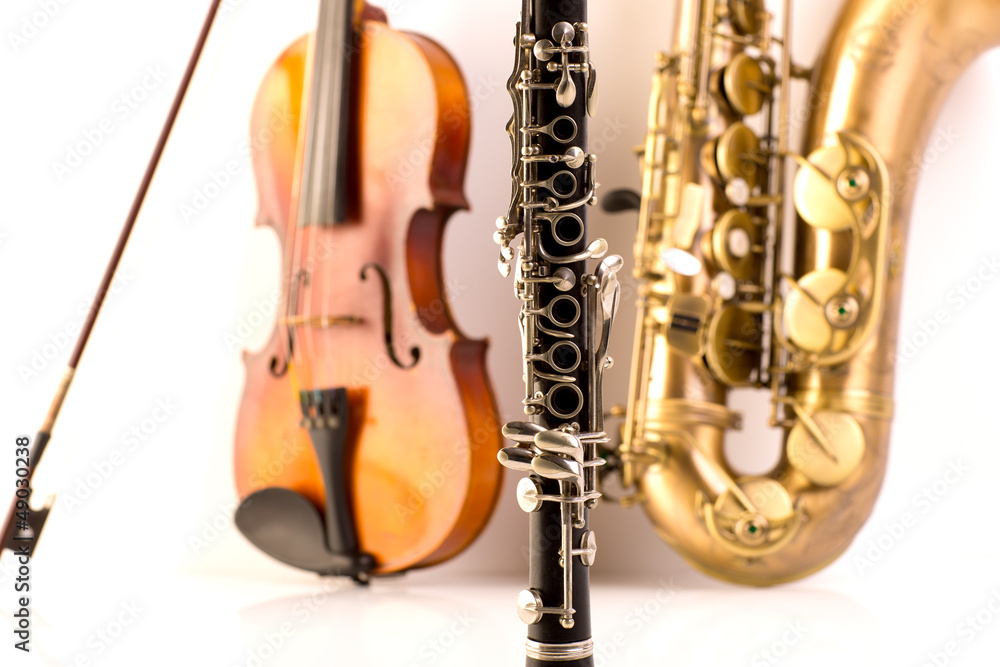 Fototapeta premium Sax tenor saxophone violin and clarinet in white