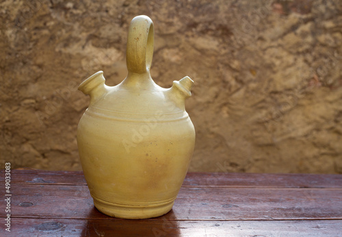 Botijo traditional clay pot jug to keep fresh water photo