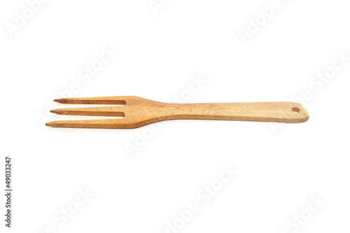 Wooden kitchen fork isolated on white background