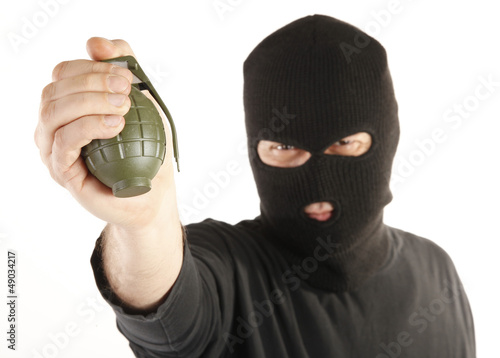 Tableau sur toile Masked man bomber aims with hand grenade