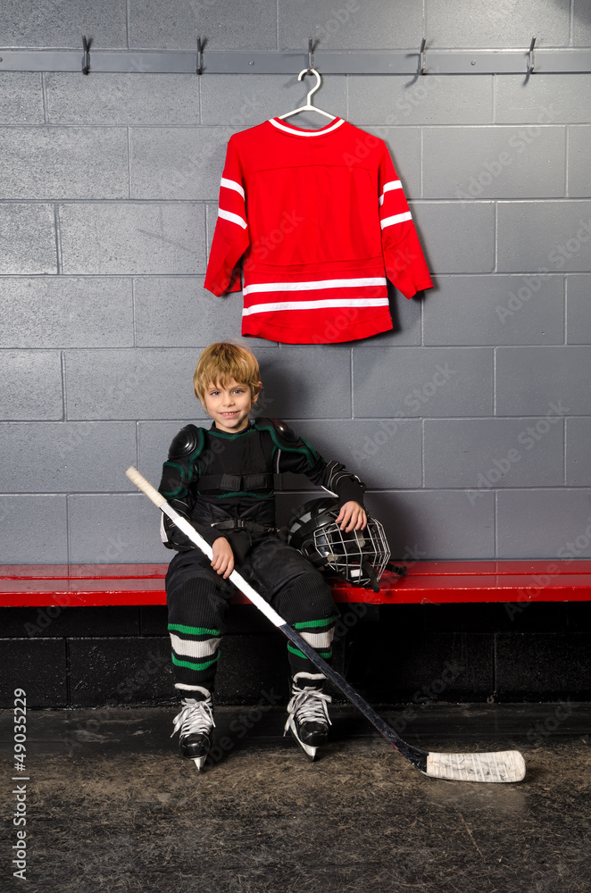 Fototapeta premium Young Boy in Hockey Dressing Room