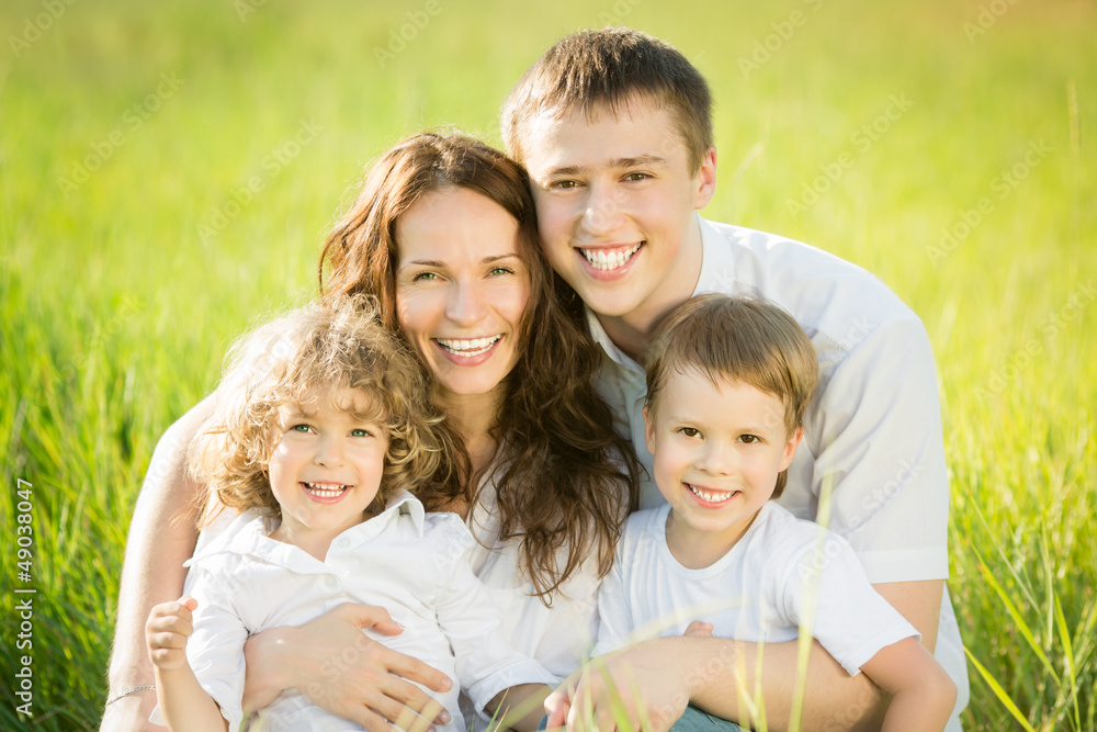 Happy family in spring field Happy family in spring field