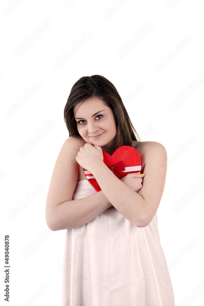 Beautiful girl with a heart shape in her hands isolated on white Beautiful girl with a heart shape in her hands isolated on white