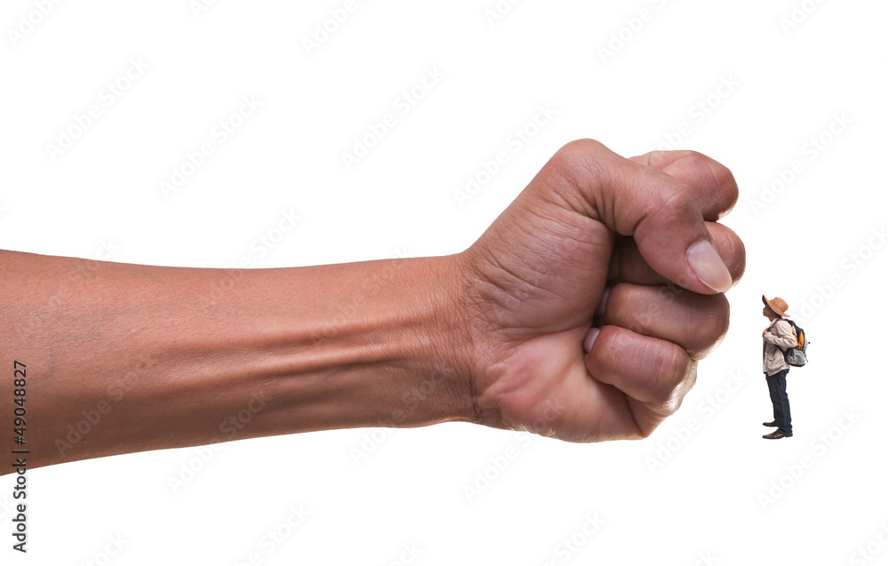 young man standing infont of punching hand young man standing infont of punching hand