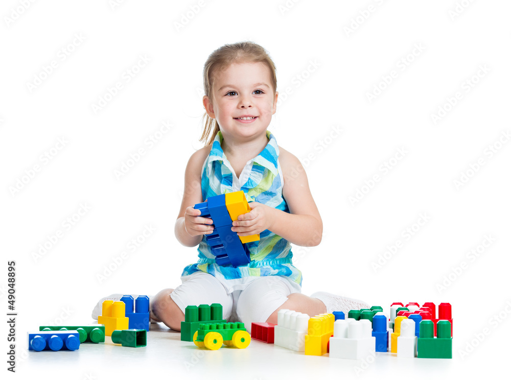 little cheerful child with construction set over white backgroun little cheerful child with construction set over white backgroun