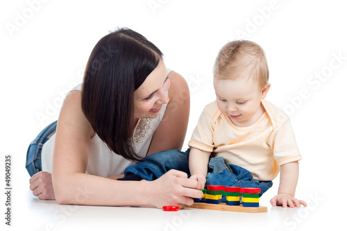 baby boy and mother playing together