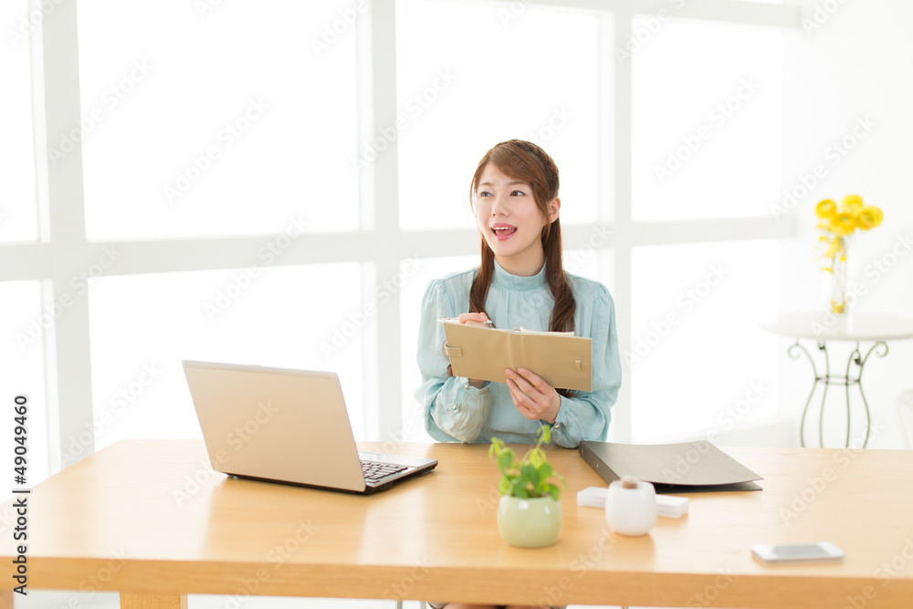 Beautiful young businesswoman working in office Beautiful young businesswoman working in office