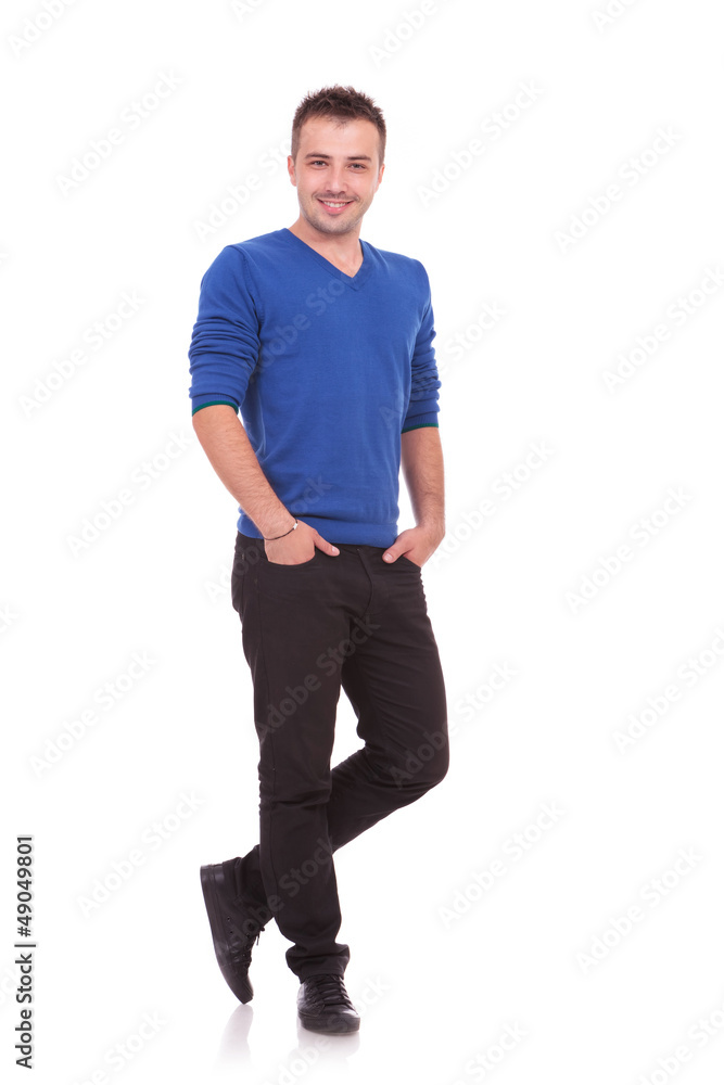 young man standing with hands in pockets young man standing with hands in pockets