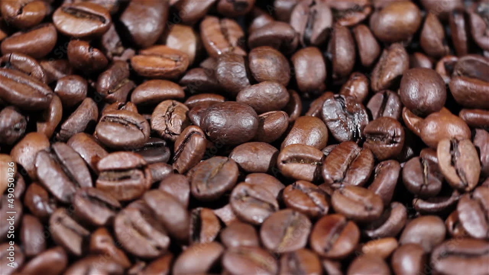 Coffee grains in rotation. Coffee grains in rotation.