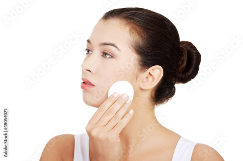 Beautiful woman with cotton pad