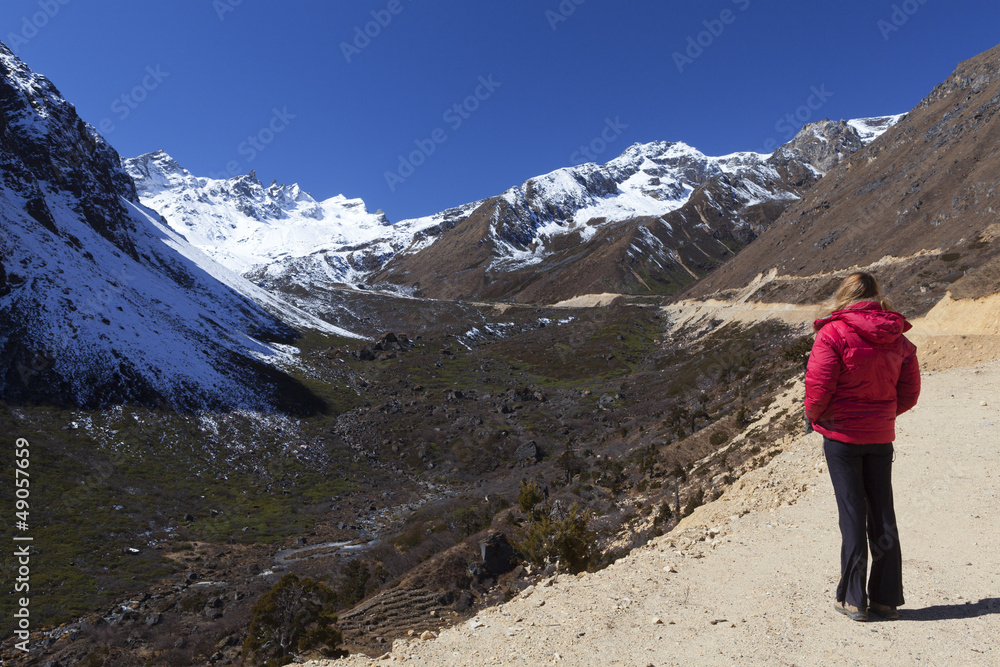 Woman enjoying view of Tsopta Valley, North Sikkim.