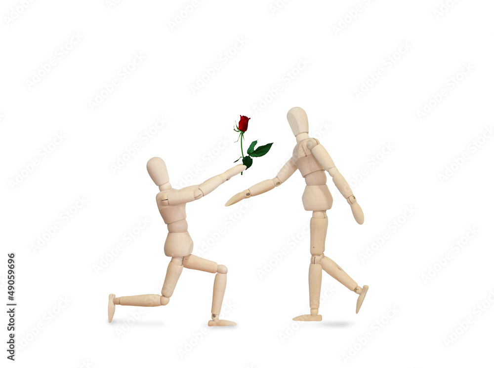 Wooden model handing over love gift to friend on Valentine day Wooden model handing over love gift to friend on Valentine day