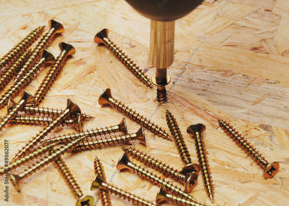 rotating wood screw with OSB Plate with more wooden screws Stock