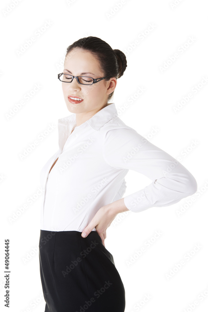 Businesswoman with back ache after long work. Businesswoman with back ache after long work.