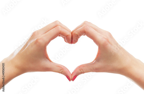 Beautiful female hands in a shape of a heart on white