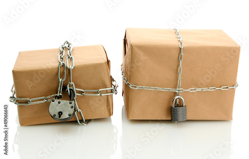 Vászonkép parcels with chains, isolated on white