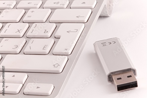 White keyboard and a pendrive