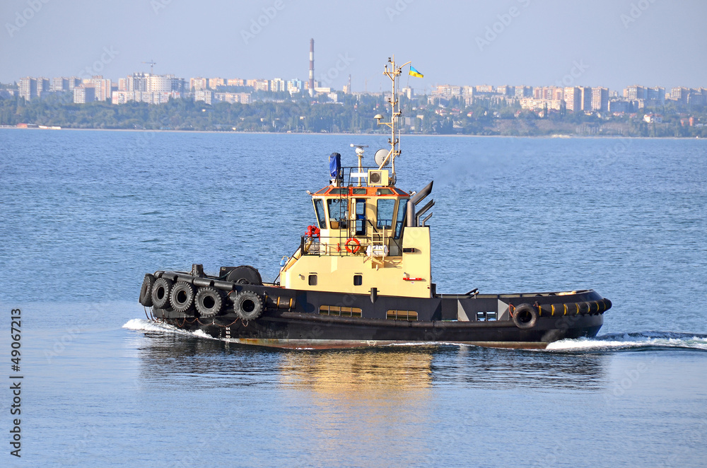 Fototapeta premium Tugboat in harbor quayside on Odessa, Ukraine