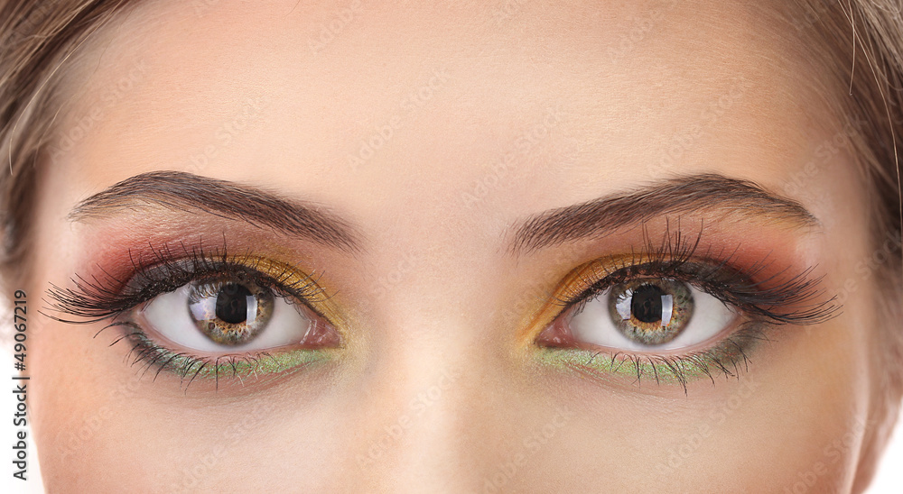 Obraz premium beautiful female eyes with bright autumn make-up