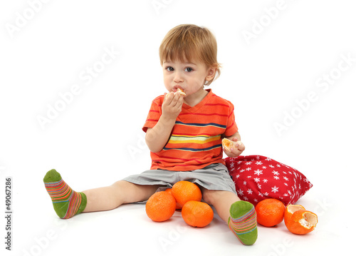cute little boy eating tang...