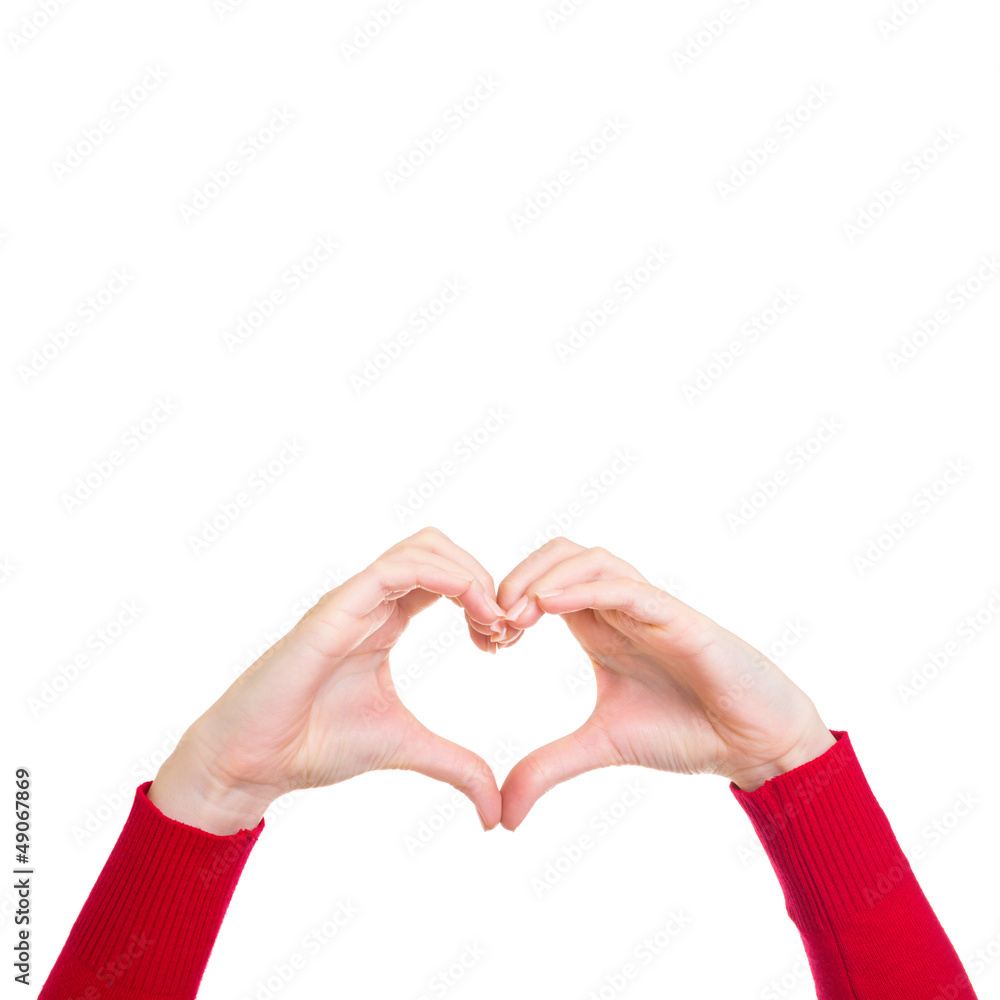 Fototapeta premium Female hands showing heart sign