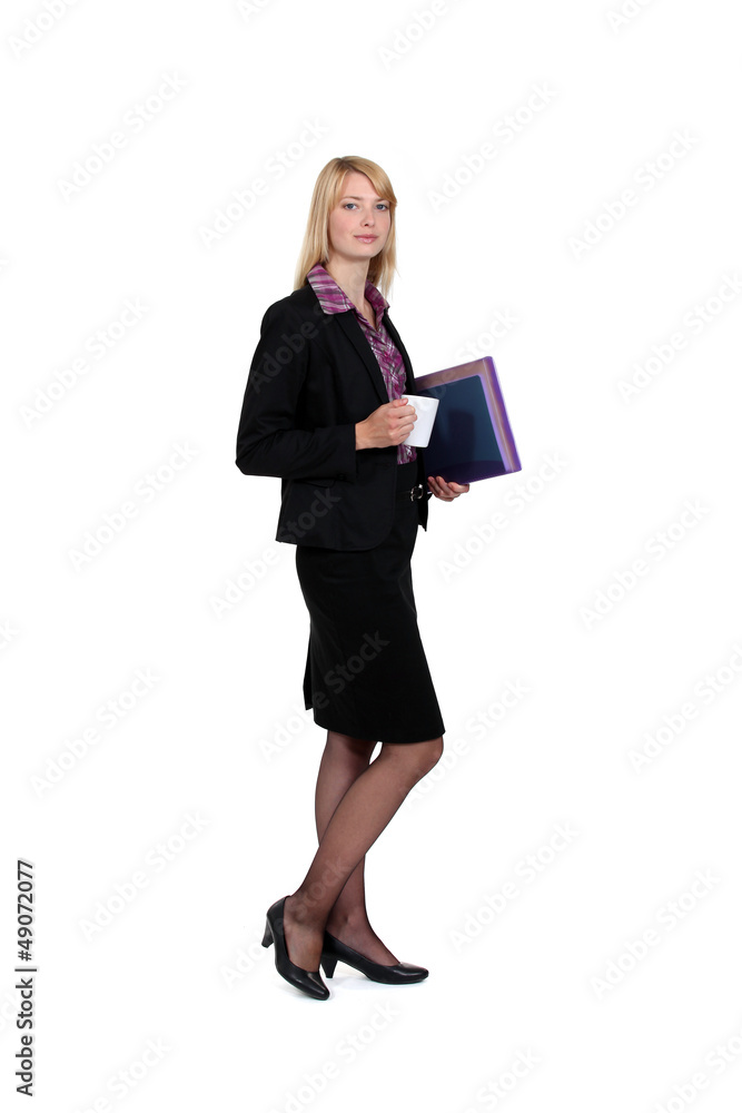 Woman with coffee cup and folders Woman with coffee cup and folders