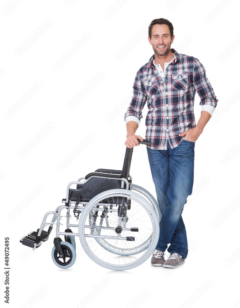 Portrait of young man with wheelchair