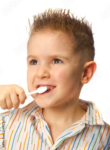 smiley boy cleans a teeth