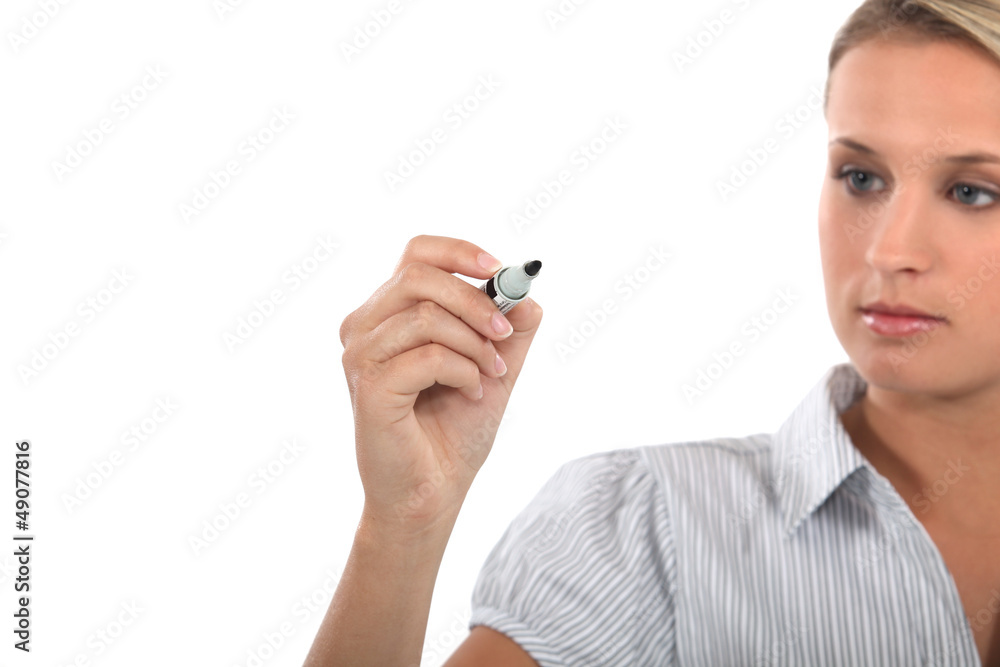 Blond woman holding marker pen Blond woman holding marker pen