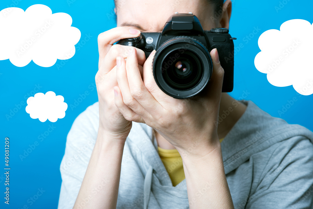 Photographer woman over fake background Photographer woman over fake background