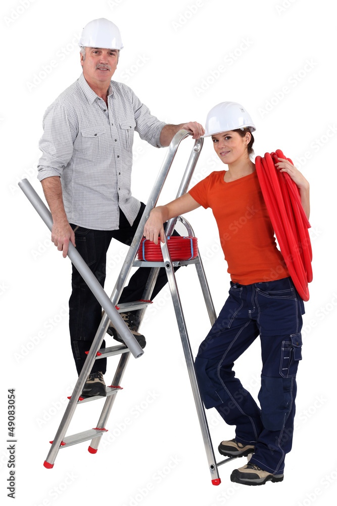 Two electrician installing wiring Two electrician installing wiring