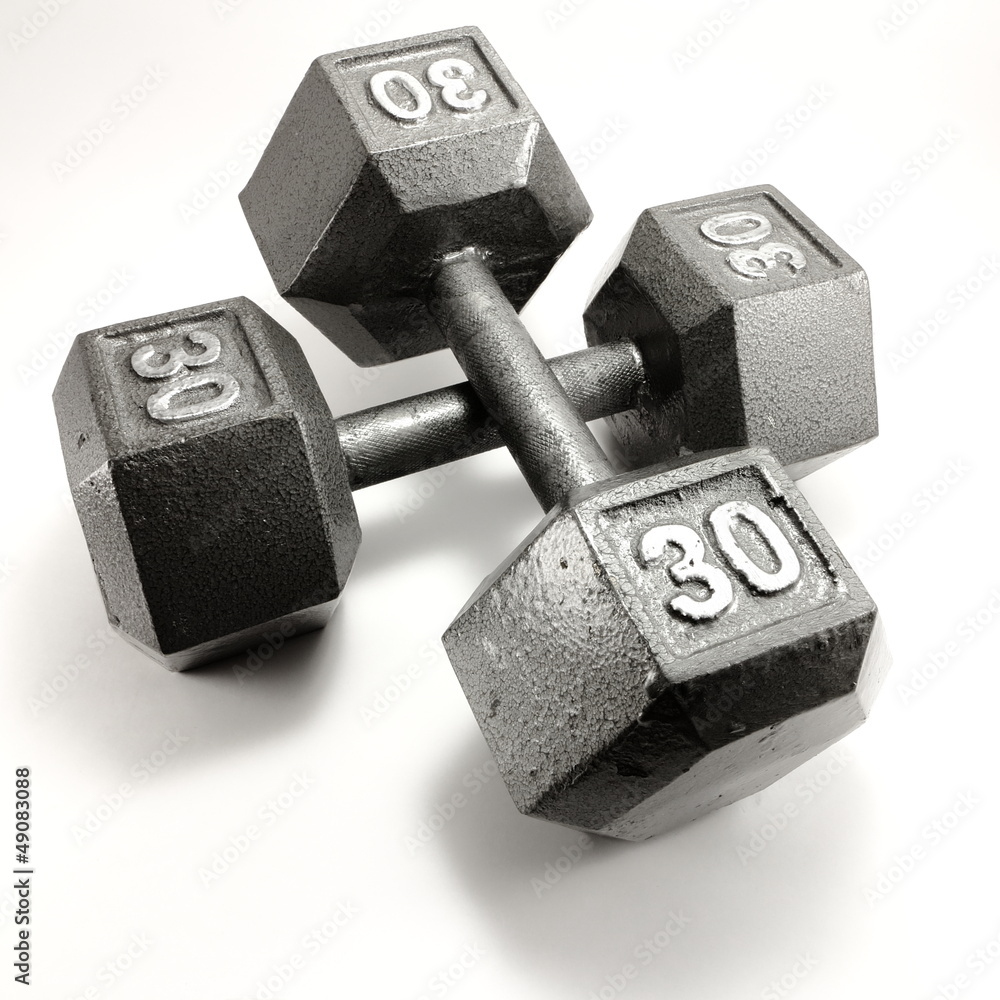 Two thirty pound dumbbell exercise weights on white background Two thirty pound dumbbell exercise weights on white background