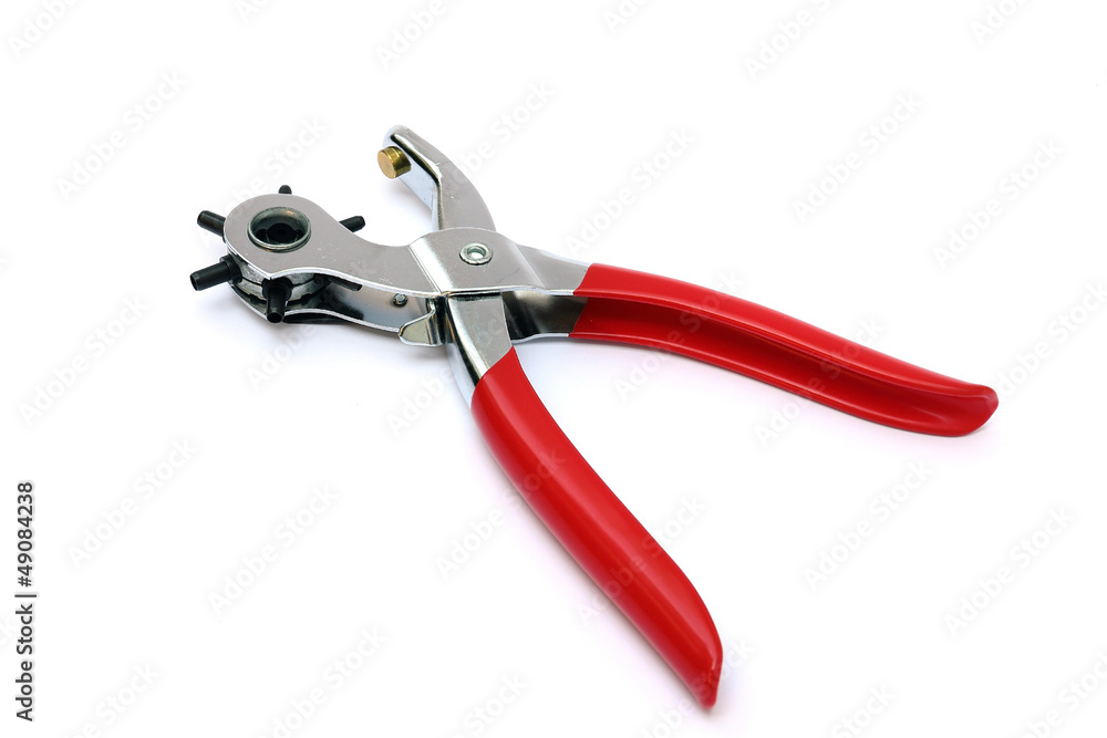Punching plier with red handle on white background Punching plier with red handle on white background