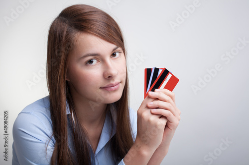 Young woman with credit cards