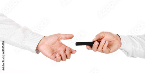 Male hand holding a mobile phone and handing it over to another