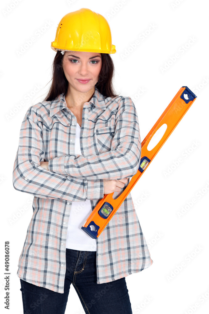 pretty female carpenter posing with ruler pretty female carpenter posing with ruler