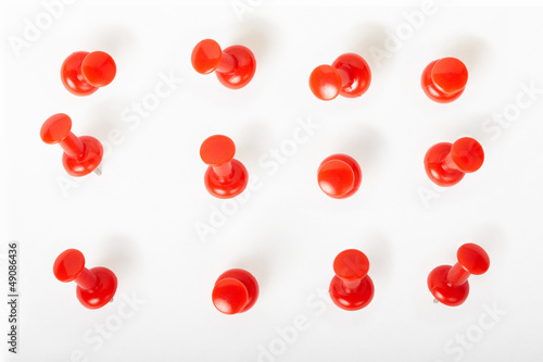 Red pin collection on white, clipping path included