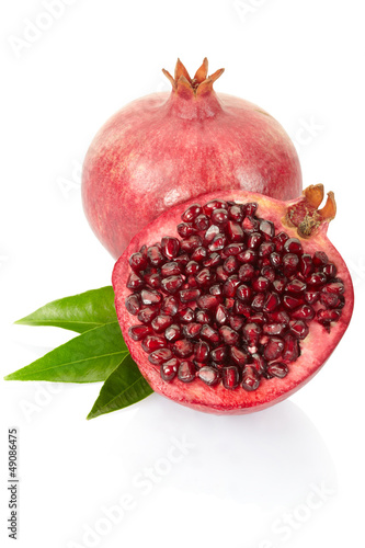 Pomegranate with leaves on white, clipping path included
