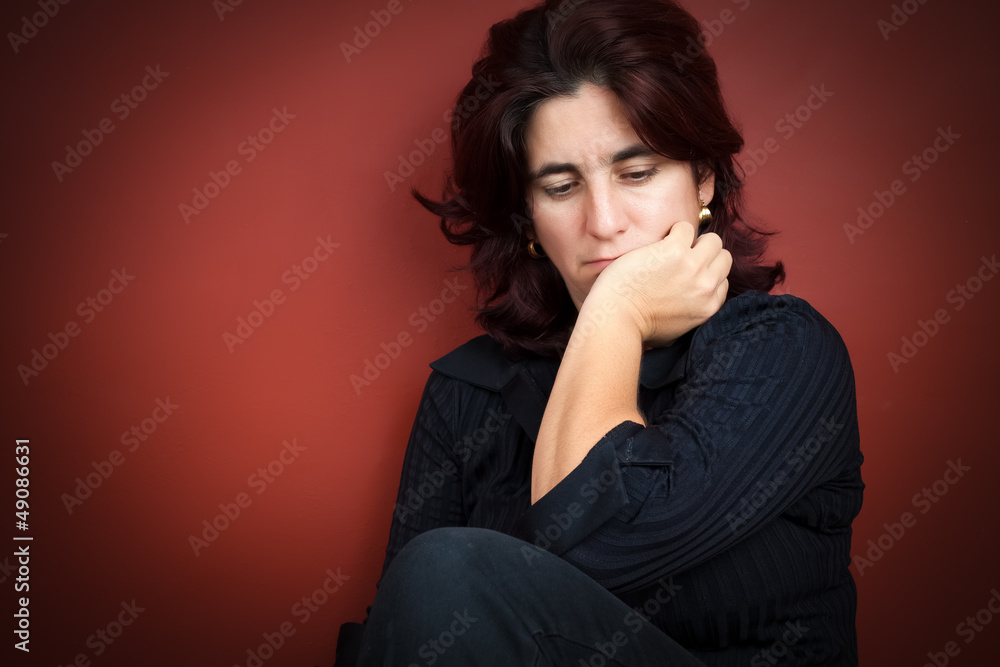 Beautiful hispanic woman with a very sad expression Beautiful hispanic woman with a very sad expression