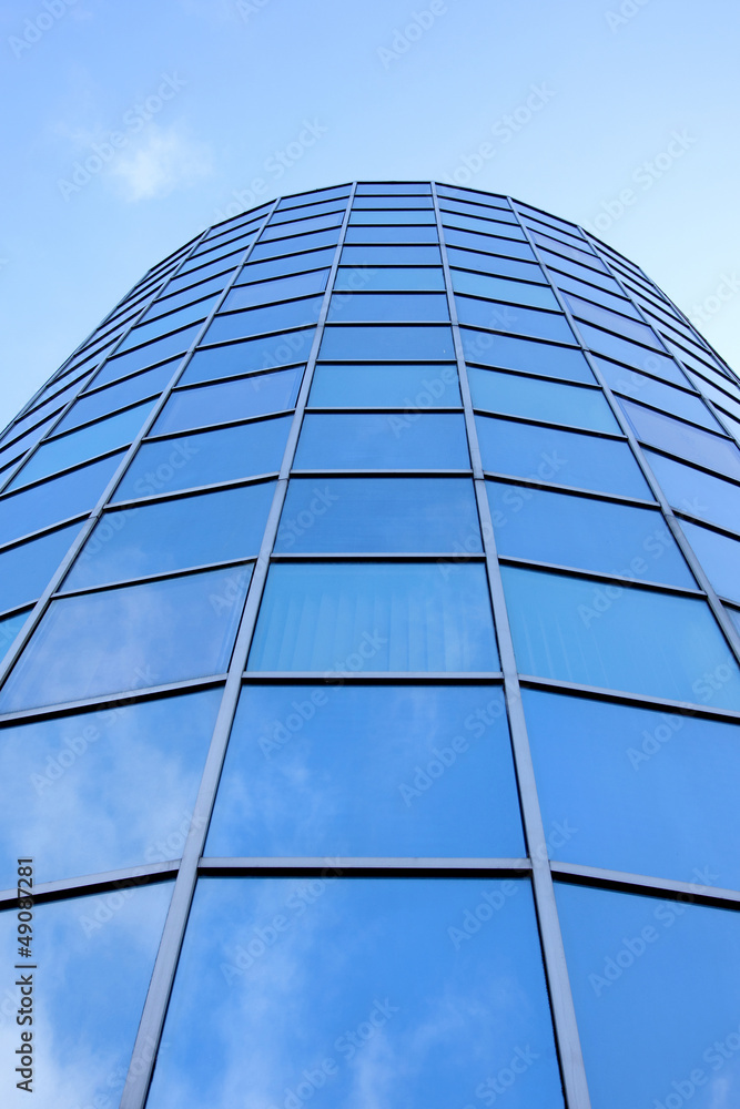 round facade of office building with blue reflected round facade of office building with blue reflected