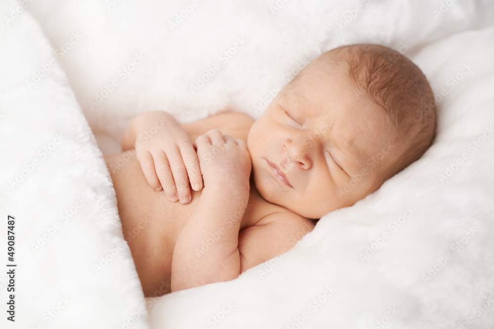 portrait of cute newborn sleeping baby