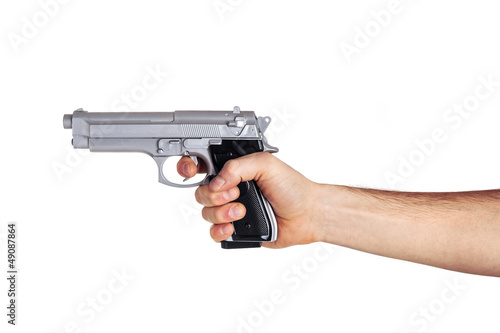 White hand holds gun isolated on white background.