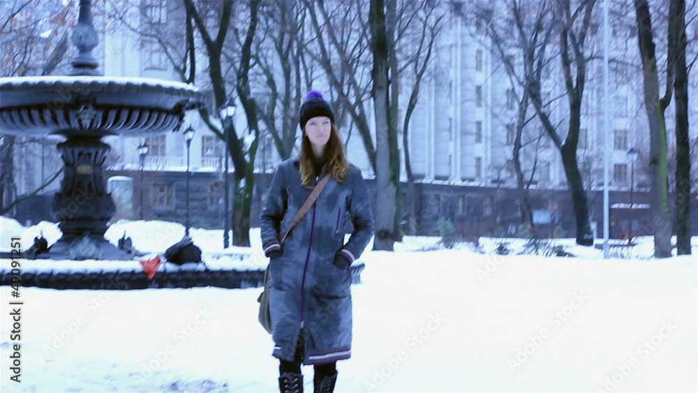 The winter girl in city park The winter girl in city park