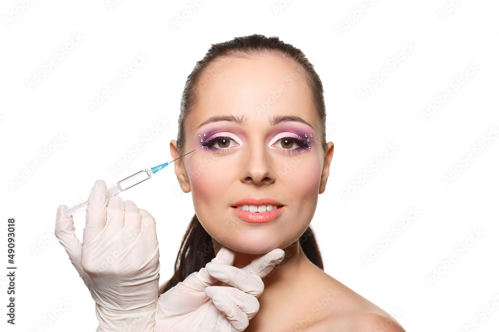 Cosmetic injection to female face.