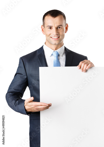 Office worker points with hand at paper copy space © Karramba Production
