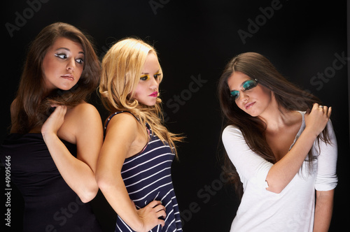 A group of young models against dark background