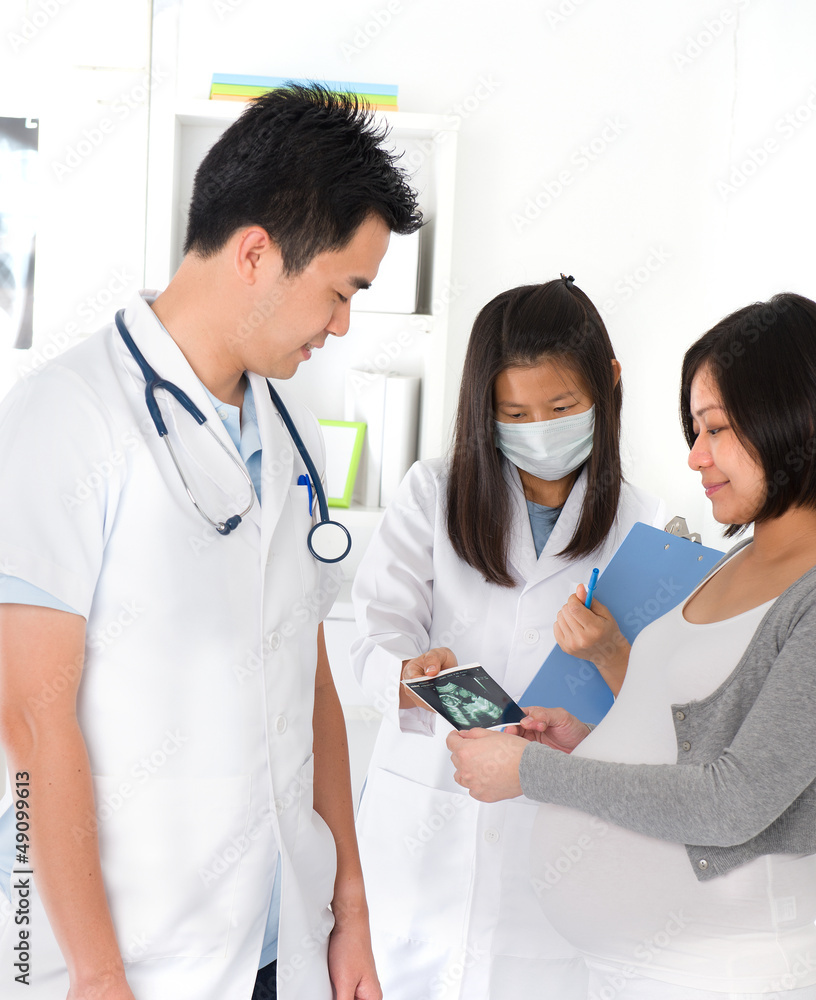 a mother performing medical pregnancy checkup test a mother performing medical pregnancy checkup test