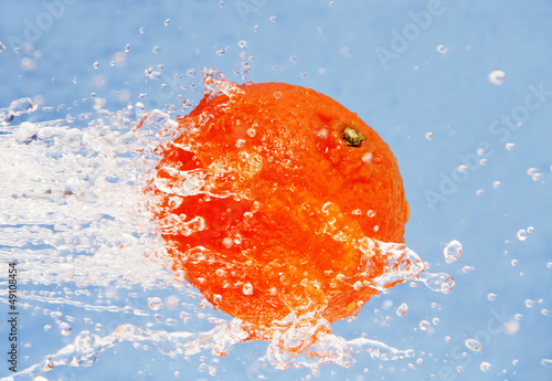 orange in a jet of water.